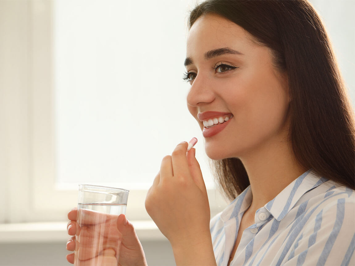 femeie cu capsulă - acid folic